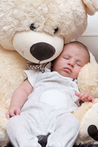 Cute baby girl sitting in toy