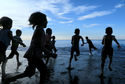 People enjoying at beach