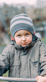 Portrait of boy standing outdoors