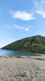 Surface level of beach against sky