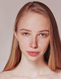 Blonde woman natural hair beauty closeup portrait