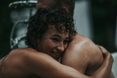 Portrait of shirtless boy in bathroom