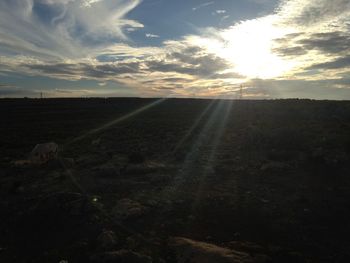 Scenic view of landscape against sky at sunset