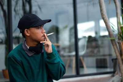 Portrait of young man looking away
