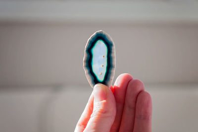 Holding a healing crystal