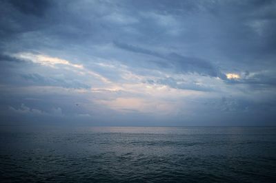 Scenic view of sea against cloudy sky