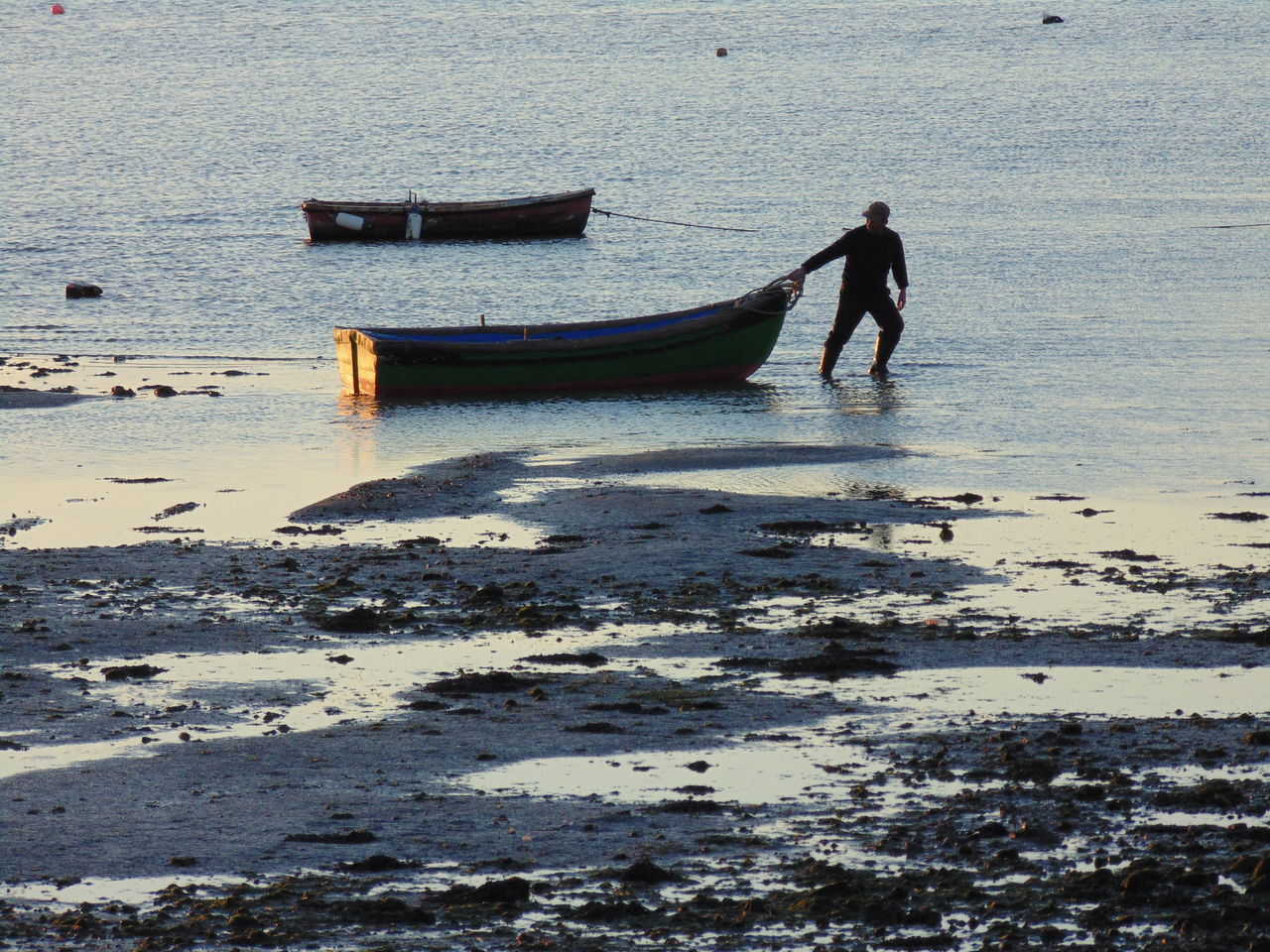 MAN STANDING AT BEACH