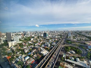 High angle view of city buildings against sky