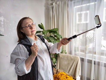 Portrait of young woman holding bouquet