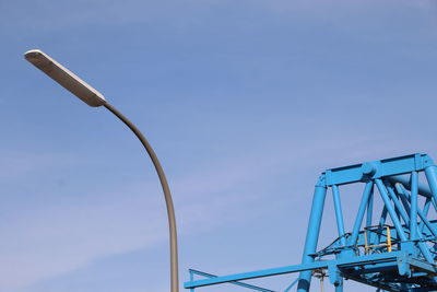 Low angle view of street light against sky