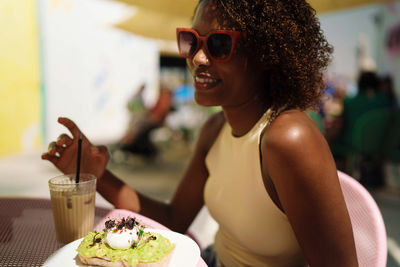 Woman sitting in the outdoor cafe