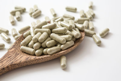 Close-up of pills on white background