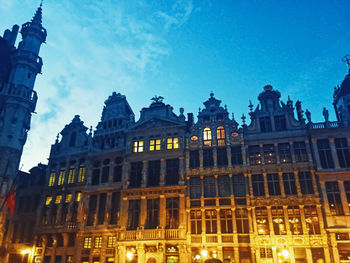 Low angle view of buildings against blue sky