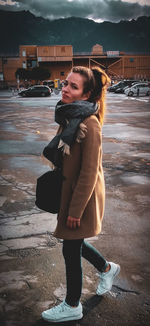 Full length of woman standing on snow