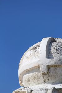 Low angle view of built structure against clear blue sky