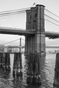 Low angle view of brooklyn bridge over river