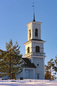 Low angle view of church and building against sky