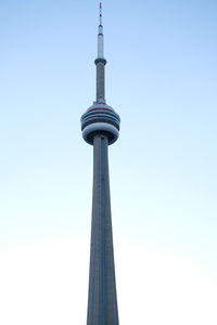 Low angle view of communications tower against sky