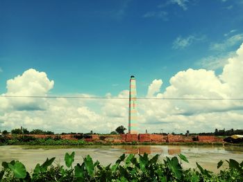 Scenic view of landscape against blue sky