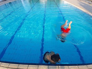 High angle view of woman swimming in pool