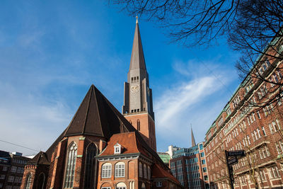 Low angle view of buildings against sky in city