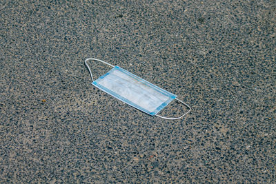 High angle view of abandoned car on road