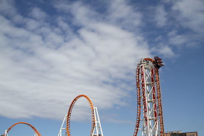 Low angle view of ferris wheel against sky