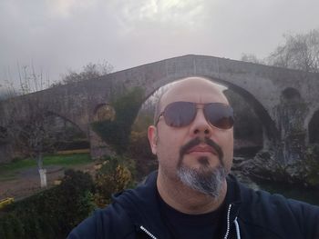 Portrait of man wearing sunglasses outdoors