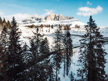 Scenic view of snow covered mountains against sky