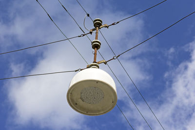 Low angle view of cables against sky