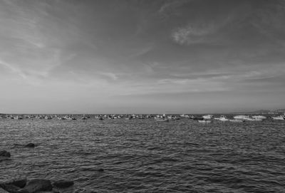 Boats moored on sea