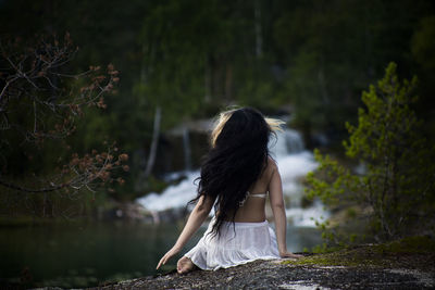 Woman sitting in a forest