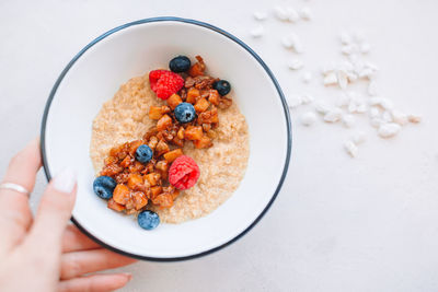 High angle view of person holding breakfast