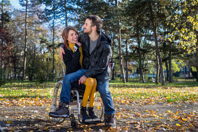 Full length of man sitting in park