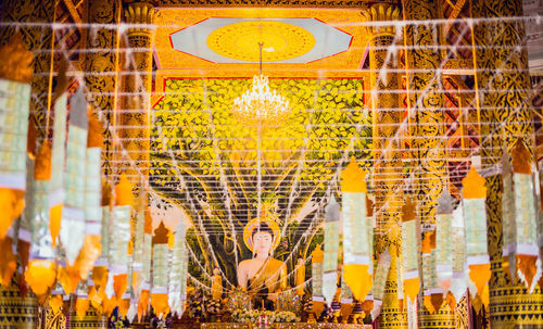 Low angle view of illuminated chandelier