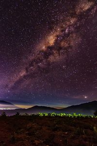 Scenic view of star field against sky at night