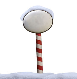 Low angle view of pole against white background