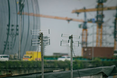 Low angle view of electricity pylon against sky