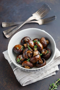 High angle view of mushrooms in bowl on table