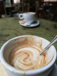 Close-up of coffee cup on table