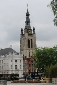 View of buildings in city against sky