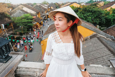 Portrait of young woman looking away