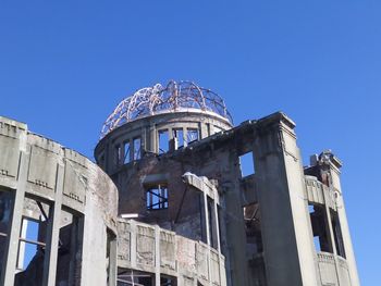 Low angle view of building against blue sky