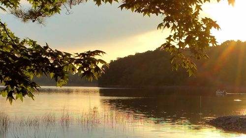 Scenic view of lake at sunset