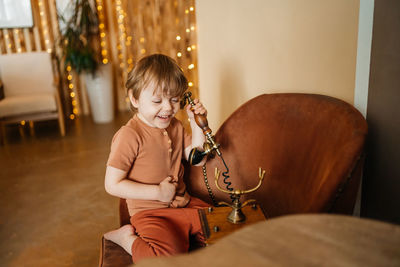 Little boy with antique phone. high quality photo