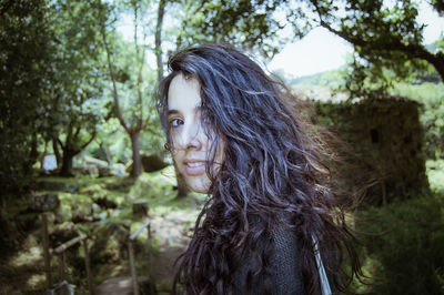 Beautiful young woman in forest