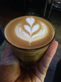 Close-up of cappuccino served on table