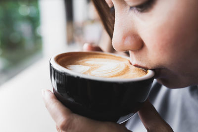 Close-up of coffee cup on table at cafe