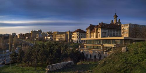 Panoramic view of buildings against sky in city