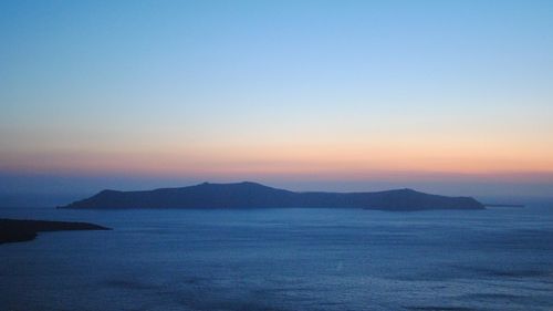 Scenic view of sea against clear sky during sunset